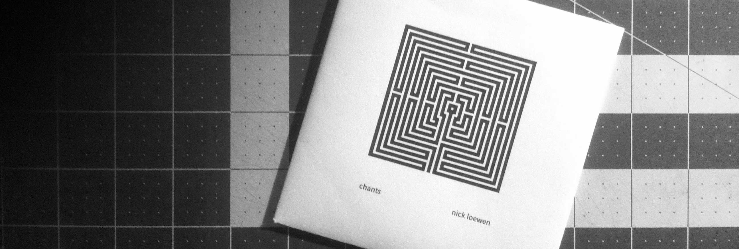 The album cover: a squared off illustration of a classical labyrinth, in stark black and white.
